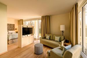 TV a/nebo společenská místnost v ubytování Parkhotel Rothof