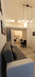 a living room with a couch and a table at Suite 332 in Cagliari