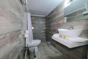 a bathroom with a sink and a toilet at Limnia Gi in Myrina