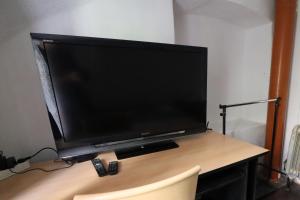 TV in/ali zabaviščno središče v nastanitvi Guesthouse Veles