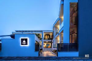 a view of a building at night at Senso Suites in Nea Peramos