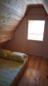 Postel nebo postele na pokoji v ubytování Vila Daniela