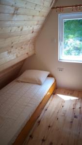 Postel nebo postele na pokoji v ubytování Vila Daniela