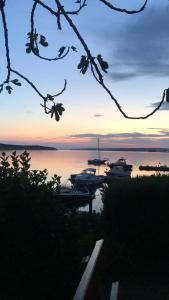 a view of a marina with boats in the water at House Ema in Barbat na Rabu