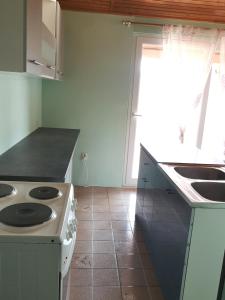 Kuchyň nebo kuchyňský kout v ubytování Apartments Sandra