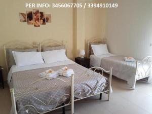 A bed or beds in a room at Lo Scrigno
