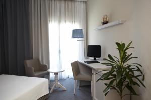 Postel nebo postele na pokoji v ubytování Rodopi Hotel