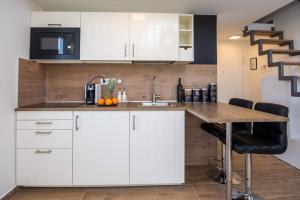 Kuchyň nebo kuchyňský kout v ubytování Apartment Velvet