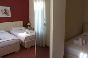 Postel nebo postele na pokoji v ubytování Signature Idea hotel