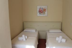 Postel nebo postele na pokoji v ubytování Signature Idea hotel