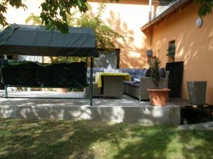 a patio with a table and an umbrella at Pension Jana Tatrovice in Tatrovice