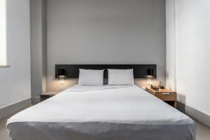 Cama o camas de una habitación en Hotel Monte Castelo