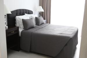 Un pat sau paturi într-o cameră la Hotel Hijata