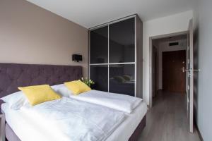 Posteľ alebo postele v izbe v ubytovaní Apartament W Rezydencji Solna