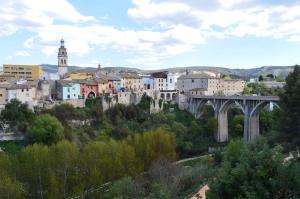 a view of a city with a bridge and buildings at Apartamentos El Llombo in Ontinyent