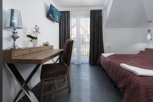 Łóżko lub łóżka w pokoju w obiekcie Morskie Apartamenty "Zefir" "Notos" "Loft" "Gniazdo"