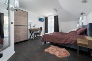Łóżko lub łóżka w pokoju w obiekcie Morskie Apartamenty "Zefir" "Notos" "Loft" "Gniazdo"