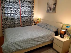 A bed or beds in a room at Casa Coqueta y confortable en Oviedo