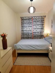A bed or beds in a room at Casa Coqueta y confortable en Oviedo