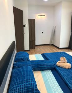 Postel nebo postele na pokoji v ubytování Home Suhaila