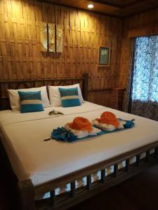 Ein Bett oder Betten in einem Zimmer der Unterkunft Nangyuan Island Dive Resort