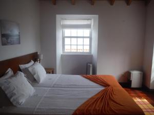 En eller flere senger på et rom på Quinta Da Ribeira Da Urze