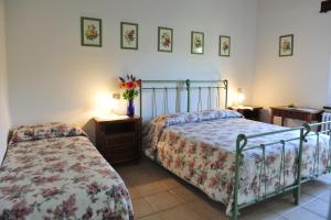 Posteľ alebo postele v izbe v ubytovaní Agriturismo La Caputa