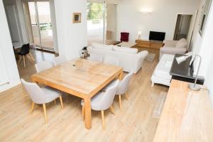 a dining room with a wooden table and chairs at ALBIAPPPART CENTRE in Albi