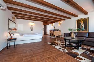 a living room with a couch and a table at Villa Nea Seaview 3-apartments! in Rovinj