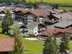 a village with houses and trees in the foreground at Ferienwohnung Dominik in Neustift im Stubaital