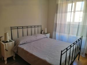 A bed or beds in a room at La casina di Domodossola