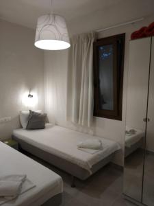 A bed or beds in a room at Isabel Artemis