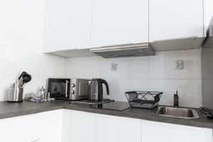 Η κουζίνα ή μικρή κουζίνα στο Tomasza 20 Apartment 140m2 +11 φωτογραφίες