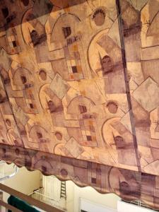 a wooden ceiling in a building at Comfort apartment for small family in Loutraki