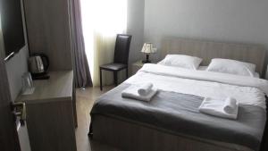 Rúm í herbergi á Soncho Kazbegi