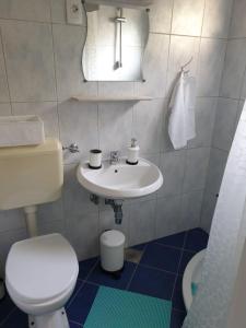 Phòng tắm tại Rooms and Apartments V&M