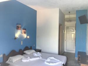 Postel nebo postele na pokoji v ubytování Anatoli Beach Hotel
