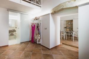 a room with white walls and a tile floor at Diletta Casa Vacanze in Lecce +26 photos