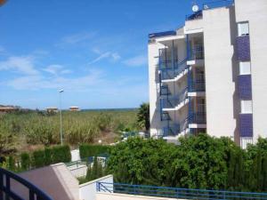 a apartment building with a view of the ocean at Oliva Nova Golf in Oliva