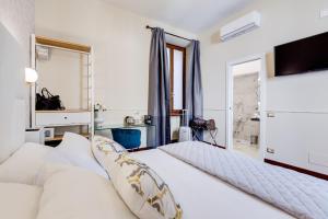 Μια τηλεόραση ή/και κέντρο ψυχαγωγίας στο Trevi Private Suites by Premium Suites Collection