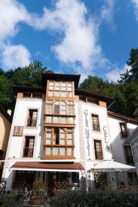 
a large building with a large window at Gran Hotel Rural Cela in Belmonte de Miranda
