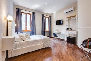 Ένα ή περισσότερα κρεβάτια σε δωμάτιο στο Trevi Private Suites by Premium Suites Collection