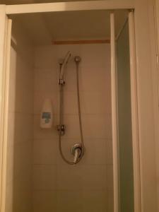 a shower with a shower head in a bathroom at B&B Il Nespolo in Salerno