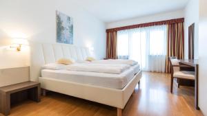 Ένα ή περισσότερα κρεβάτια σε δωμάτιο στο Hotel Markushof - Adults only