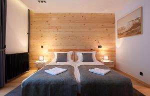 Rúm í herbergi á Hotel Žabljak