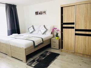 Posteľ alebo postele v izbe v ubytovaní Panorama Apartments