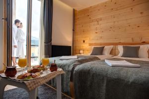 Rúm í herbergi á Hotel Žabljak