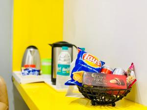 a basket of food sitting on a yellow counter at City Empire New Delhi Train Station in New Delhi +84 photos