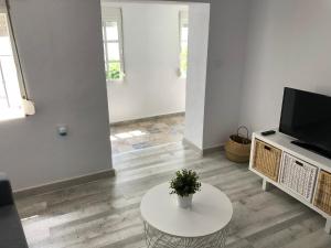 Telewizja i/lub zestaw kina domowego w obiekcie CH Apartments
