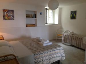 Postel nebo postele na pokoji v ubytování B&B Casa dei Nonni